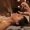 A female cosmetologist holds a pipette with essential oil before aromatherapy and massage to the